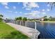 Picturesque waterfront view with well maintained docks and lush tropical landscaping at 245 Lido Dr, Punta Gorda, FL 33950