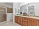 Spacious bathroom featuring a double vanity, walk-in shower, and neutral tones at 24504 Buckingham Way, Punta Gorda, FL 33980