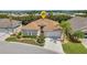 Well-maintained single-story home boasting lush landscaping and a two-car garage at 24504 Buckingham Way, Punta Gorda, FL 33980