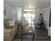 Cozy living room with a sliding glass door to a screened patio at 326 Trailorama Dr, North Port, FL 34287