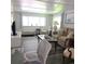 Comfortable living room with a sofa, chair, and bright natural light at 326 Trailorama Dr, North Port, FL 34287