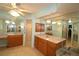 Bathroom featuring tiled floors, a walk-in shower, and updated light fixtures at 39 Norman St, Port Charlotte, FL 33954