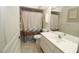 Bathroom featuring a shower with curtain, toilet, vanity with mirror, and tiled floor at 39 Norman St, Port Charlotte, FL 33954