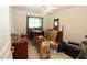 Bedroom featuring a ceiling fan, tile floors, and a mirror at 39 Norman St, Port Charlotte, FL 33954