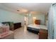 Spacious bedroom featuring a ceiling fan, tile floors, and light blue walls at 39 Norman St, Port Charlotte, FL 33954