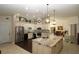 Bright eat-in kitchen with tiled flooring and a stainless steel refrigerator at 39 Norman St, Port Charlotte, FL 33954