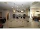 Spacious kitchen features a center island, stainless steel appliances, and decorative lighting fixtures at 39 Norman St, Port Charlotte, FL 33954