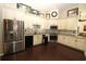 Kitchen featuring stainless steel appliances, wood-look flooring, and backsplash at 39 Norman St, Port Charlotte, FL 33954