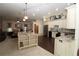 Spacious kitchen featuring a center island with granite countertops and stainless steel appliances at 39 Norman St, Port Charlotte, FL 33954