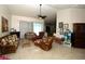 Bright living room with tile floors and comfortable seating, ideal for relaxation at 39 Norman St, Port Charlotte, FL 33954