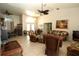 Open-concept living room with tile floors, ceiling fans, and stylish wicker furniture at 39 Norman St, Port Charlotte, FL 33954