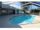 This in-ground pool is surrounded by a screened enclosure, providing a private outdoor oasis at 39 Norman St, Port Charlotte, FL 33954