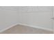 Empty walk-in closet featuring light gray walls, wood-look tile flooring, and wire shelving at 4627 Schoen St, North Port, FL 34291