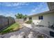Fenced backyard with patio area and well-established greenery, offering privacy at 475 Whippoorwill Dr, Venice, FL 34293