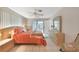 Bright bedroom with white tile floors, ceiling fan, and a view of the lanai at 475 Whippoorwill Dr, Venice, FL 34293
