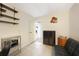 Bright home office featuring shelving, tile flooring, and neutral paint palette at 475 Whippoorwill Dr, Venice, FL 34293