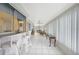 Spacious sun room with tile flooring, bar seating, and a bright, airy atmosphere at 475 Whippoorwill Dr, Venice, FL 34293