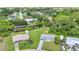 Neighborhood aerial view showcasing a canal-front property with an expansive lawn and nearby waterways at 769 Crestview Nw Cir, Port Charlotte, FL 33948