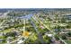 Aerial view of the property along a scenic waterway in a charming neighborhood at 769 Crestview Nw Cir, Port Charlotte, FL 33948