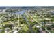 Overhead aerial view of neighborhood near a canal, highlighting waterway access and residential layout at 769 Crestview Nw Cir, Port Charlotte, FL 33948
