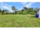 Sprawling backyard features a palm tree and plenty of space at 769 Crestview Nw Cir, Port Charlotte, FL 33948