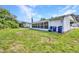 Spacious backyard features a screened in porch with a small RV parked nearby at 769 Crestview Nw Cir, Port Charlotte, FL 33948