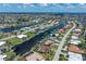 Stunning aerial view of waterfront property with canal access and lush landscaping in a desirable neighborhood at 825 Via Tunis, Punta Gorda, FL 33950