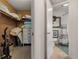 A bathroom and closet with decorative accents, shelving, and lots of storage space for linens and cleaning supplies at 825 Via Tunis, Punta Gorda, FL 33950