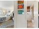 View from a bedroom into an adjacent bathroom featuring a privacy shade, decorative accents, and tiled shower at 825 Via Tunis, Punta Gorda, FL 33950