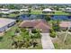 Lovely single-Gathering home featuring mature landscaping, a tile roof, and waterfront access in a desirable neighborhood at 825 Via Tunis, Punta Gorda, FL 33950