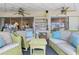 Relaxing covered lanai has ceiling fans and comfortable seating at 825 Via Tunis, Punta Gorda, FL 33950