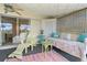 Covered lanai with daybed, lounge chair, and access to the pool at 825 Via Tunis, Punta Gorda, FL 33950