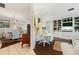 Open-concept living room leading to the dining room, offering an inviting space for gatherings and entertaining at 825 Via Tunis, Punta Gorda, FL 33950
