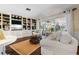 The spacious living room is bright and airy and has a built-in entertainment center with shelving and storage at 825 Via Tunis, Punta Gorda, FL 33950
