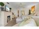 Bright main bedroom featuring fireplace, television, and an en suite bath with a walk-in closet at 825 Via Tunis, Punta Gorda, FL 33950