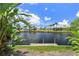 Scenic waterfront view showcasing a lush landscape and serene canal, under a beautiful sky at 825 Via Tunis, Punta Gorda, FL 33950
