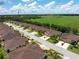 Overhead shot displaying neighborhood homes with green spaces and a well-planned community layout at 8814 Tuscany Isles Dr, Punta Gorda, FL 33950