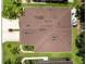 Aerial view of the home showcasing the roof, landscaping, driveway, and outdoor seating at 8814 Tuscany Isles Dr, Punta Gorda, FL 33950