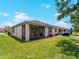 Well-kept backyard with a screened enclosure, providing a private outdoor living space at 8814 Tuscany Isles Dr, Punta Gorda, FL 33950