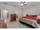 Spacious bedroom with ample natural light, ceiling fan and direct access to the bathroom at 8814 Tuscany Isles Dr, Punta Gorda, FL 33950
