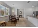 Open dining area with stylish furnishings, large windows, and seamless flow to the kitchen at 8814 Tuscany Isles Dr, Punta Gorda, FL 33950