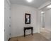 Bright foyer featuring tile flooring and a decorative table with mirror at 8814 Tuscany Isles Dr, Punta Gorda, FL 33950
