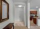 Light-filled foyer with beige carpet leading into the kitchen at 8814 Tuscany Isles Dr, Punta Gorda, FL 33950