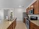 Spacious kitchen featuring stainless steel appliances and granite countertops at 8814 Tuscany Isles Dr, Punta Gorda, FL 33950