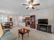 Open-concept living area with a dining area and partial view of the modern kitchen at 8814 Tuscany Isles Dr, Punta Gorda, FL 33950