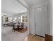 Open-concept living and dining area with neutral decor, carpet and lots of natural light at 8814 Tuscany Isles Dr, Punta Gorda, FL 33950
