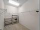 Spacious walk-in closet featuring carpet flooring, wire shelving, and ample storage for organized wardrobe solutions at 8814 Tuscany Isles Dr, Punta Gorda, FL 33950