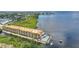 Impressive aerial view highlights a waterfront condo with a pool, boat docks, and picturesque waterfront scenery at 900 E Marion Ave # 1403, Punta Gorda, FL 33950