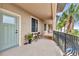 Charming condo balcony features sleek railings, outdoor seating, and scenic views of palm trees and sparkling waters at 900 E Marion Ave # 1403, Punta Gorda, FL 33950
