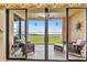 Screened-in lanai with seating area and expansive views of the Intracoastal Waterway at 900 E Marion Ave # 1403, Punta Gorda, FL 33950